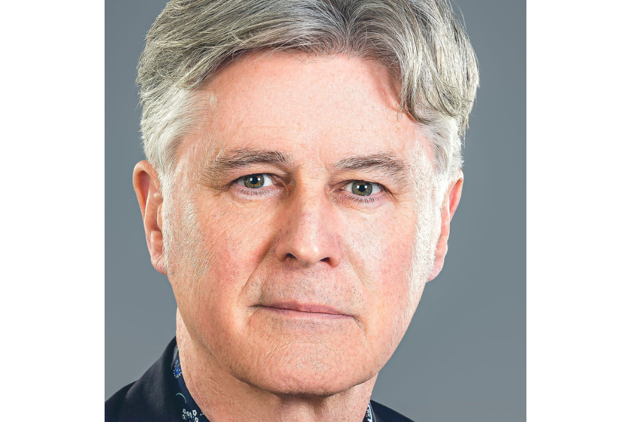 Headshot of a man with silver hair.