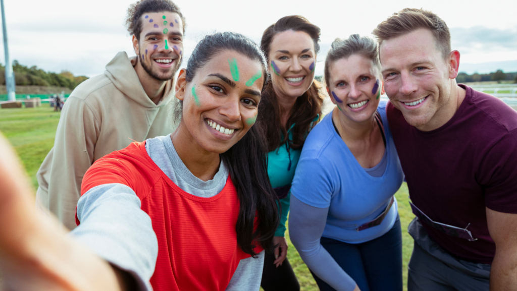 Image of a group of sporty people smiling.